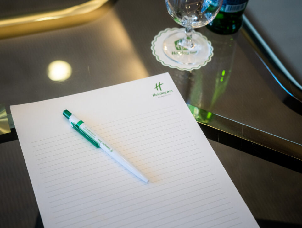 Omega meeting room notepad and refreshments.