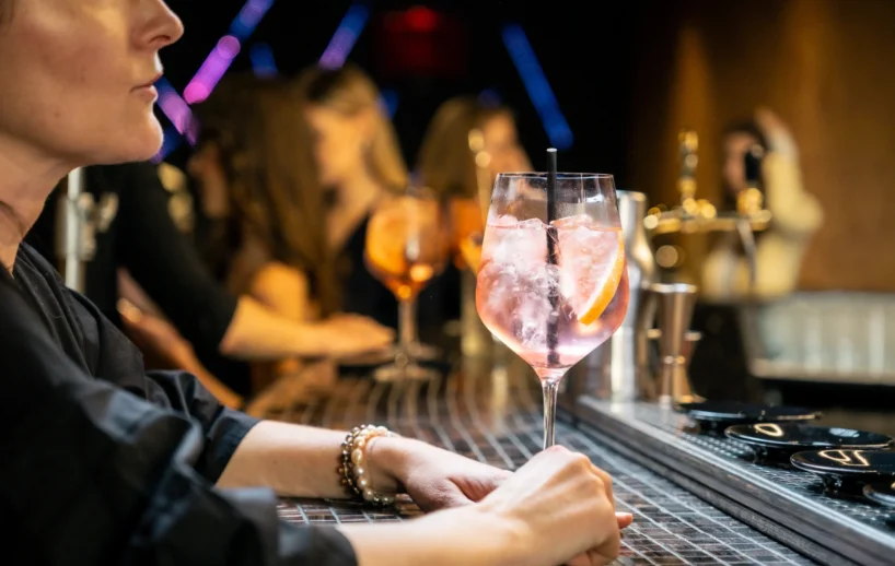 Bartender serving cocktails at HI.5 Night Bar.