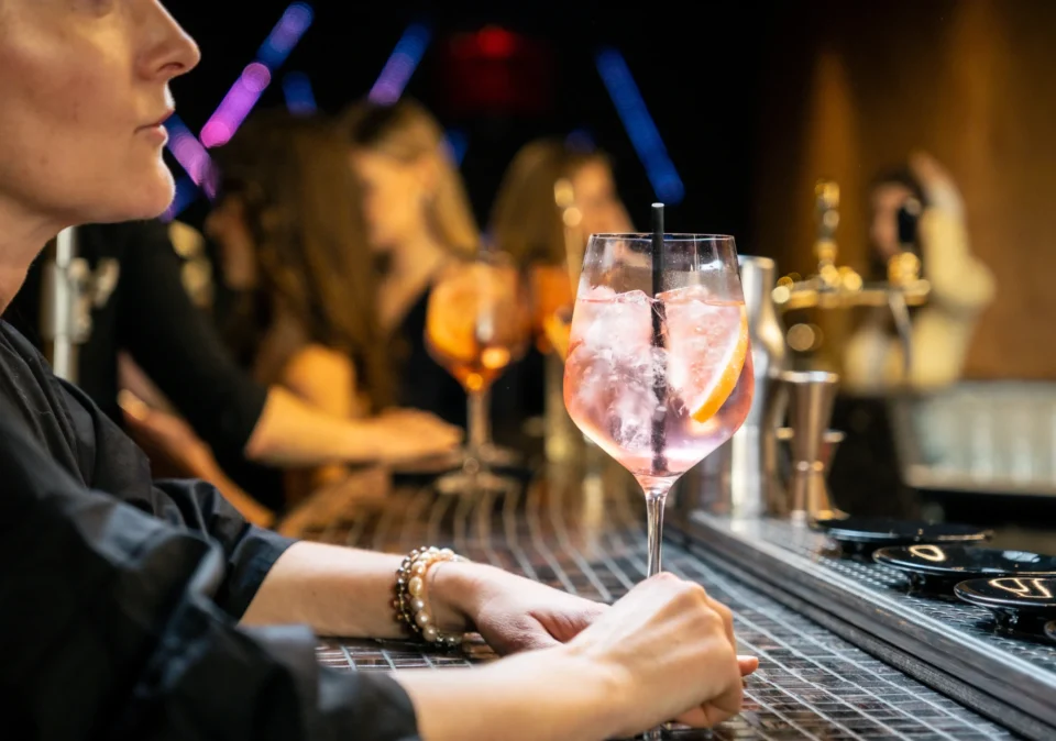 Bartender serving cocktails at HI.5 Night Bar.
