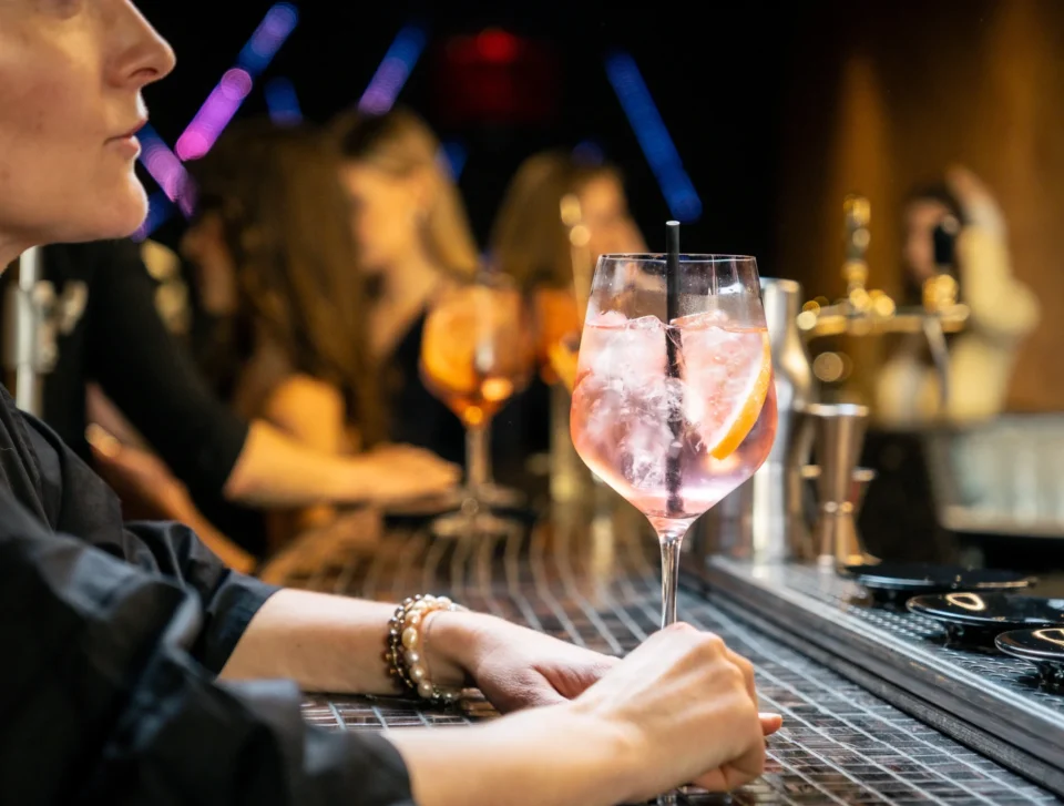 Bartender serving cocktails at HI.5 Night Bar.