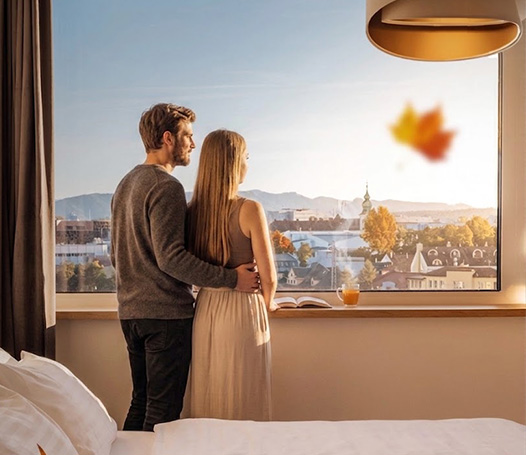 Couple overlooking Žilina during a Summer Stay.