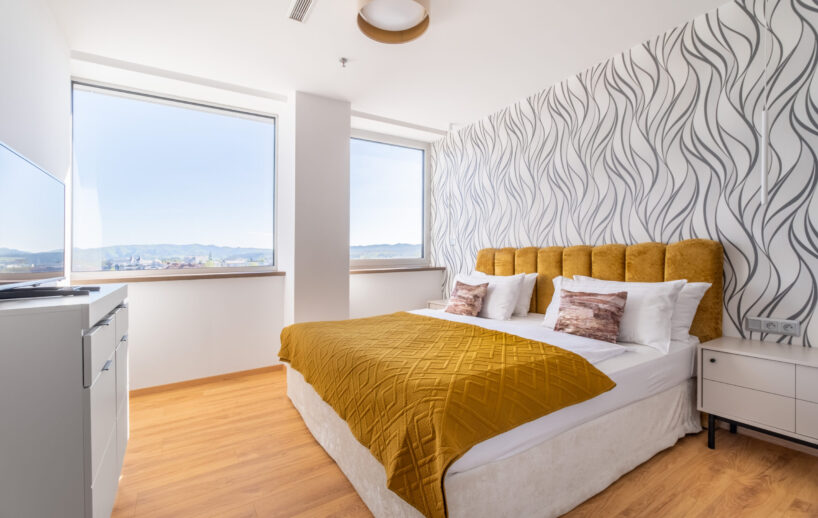 Apartment bedroom with mountain view.